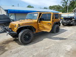 2014 Jeep Wrangler Unlimited Rubicon Gold vin: 1C4HJWFG4EL217774