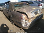 1999 Lincoln Town Car Signature Золотой vin: 1LNHM82W0XY705671