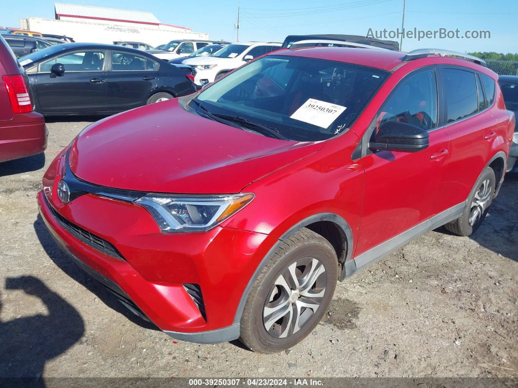 2016 Toyota Rav4 Le Red vin: 2T3ZFREV3GW299603