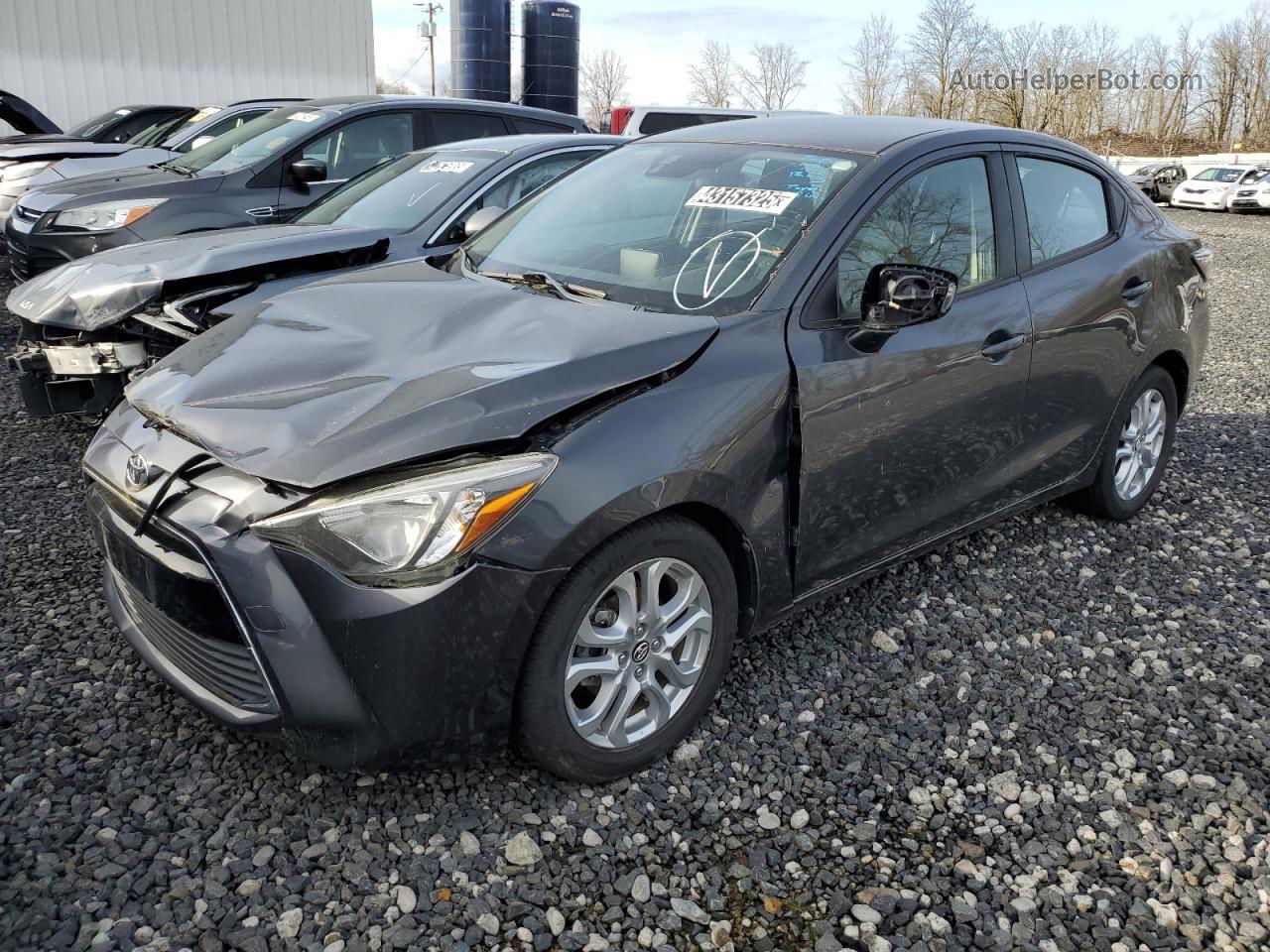 2018 Toyota Yaris Ia  Charcoal vin: 3MYDLBYV1JY310607 Damage: Left Head Lamp, Loose, Repair Required
