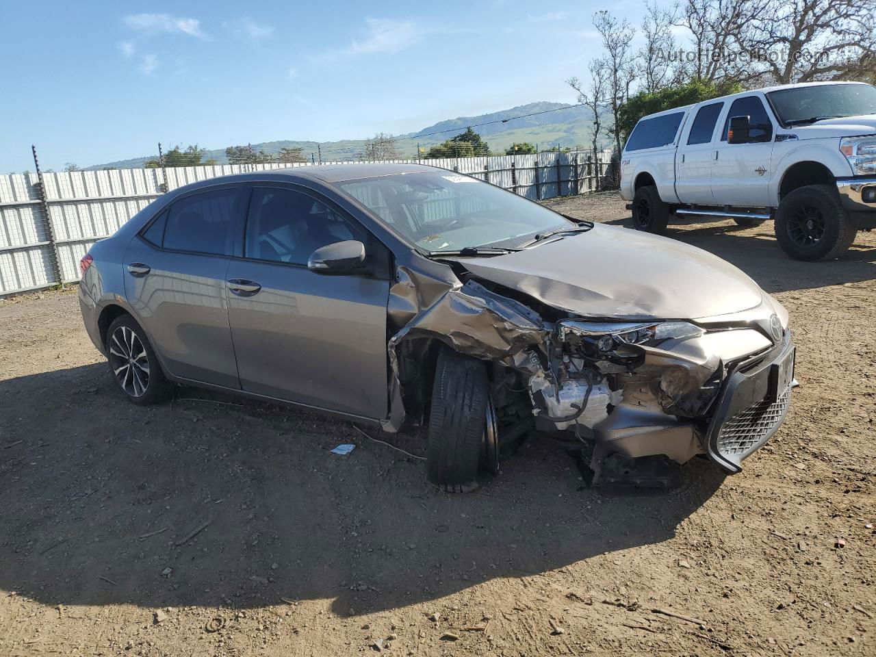 2017 Toyota Corolla L Tan vin: 5YFBURHE0HP699780