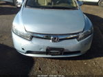 2006 Honda Civic Hybrid   Light Blue vin: JHMFA36226S021512