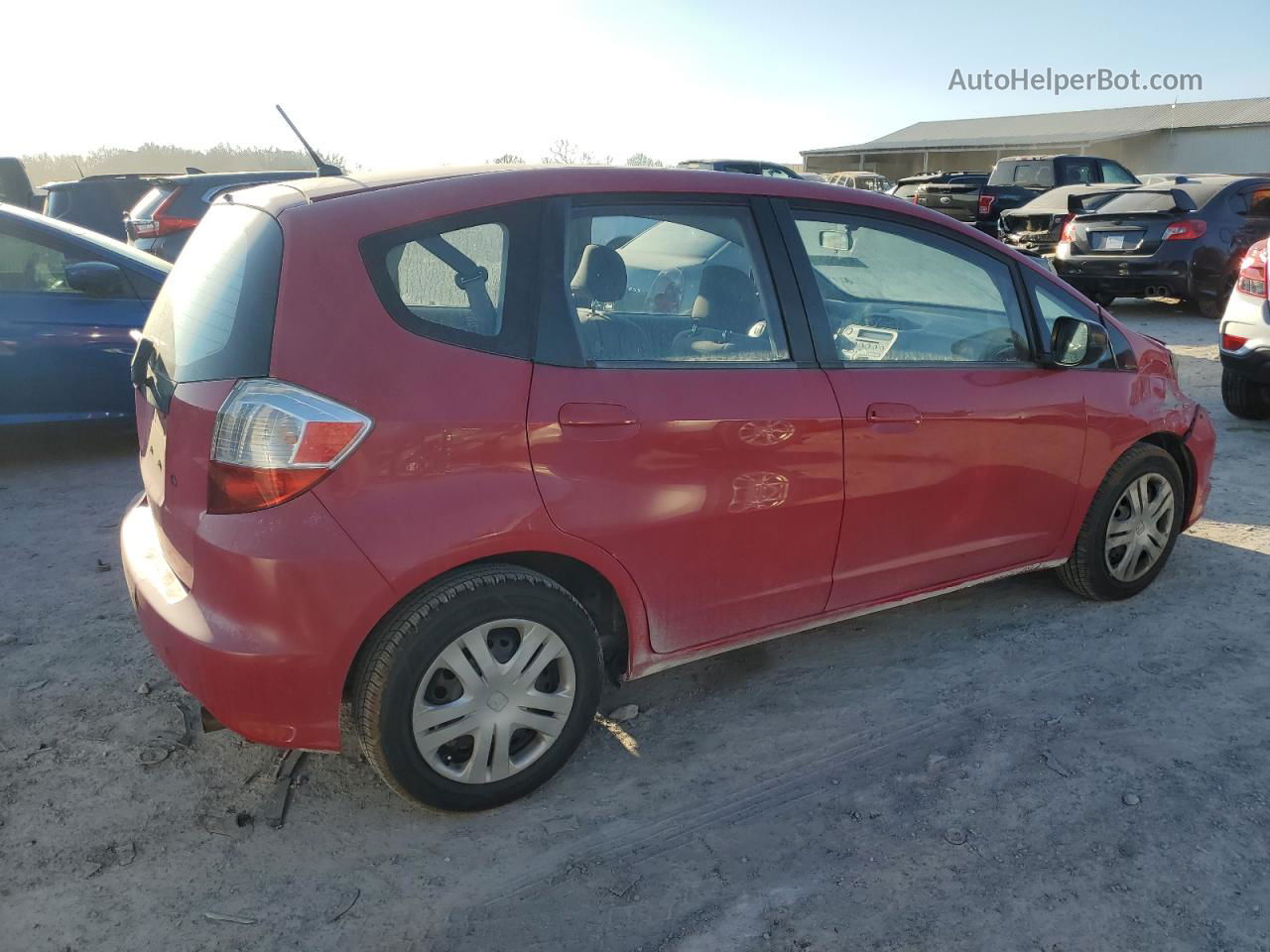 2009 Honda Fit  Red vin: JHMGE88219C003021