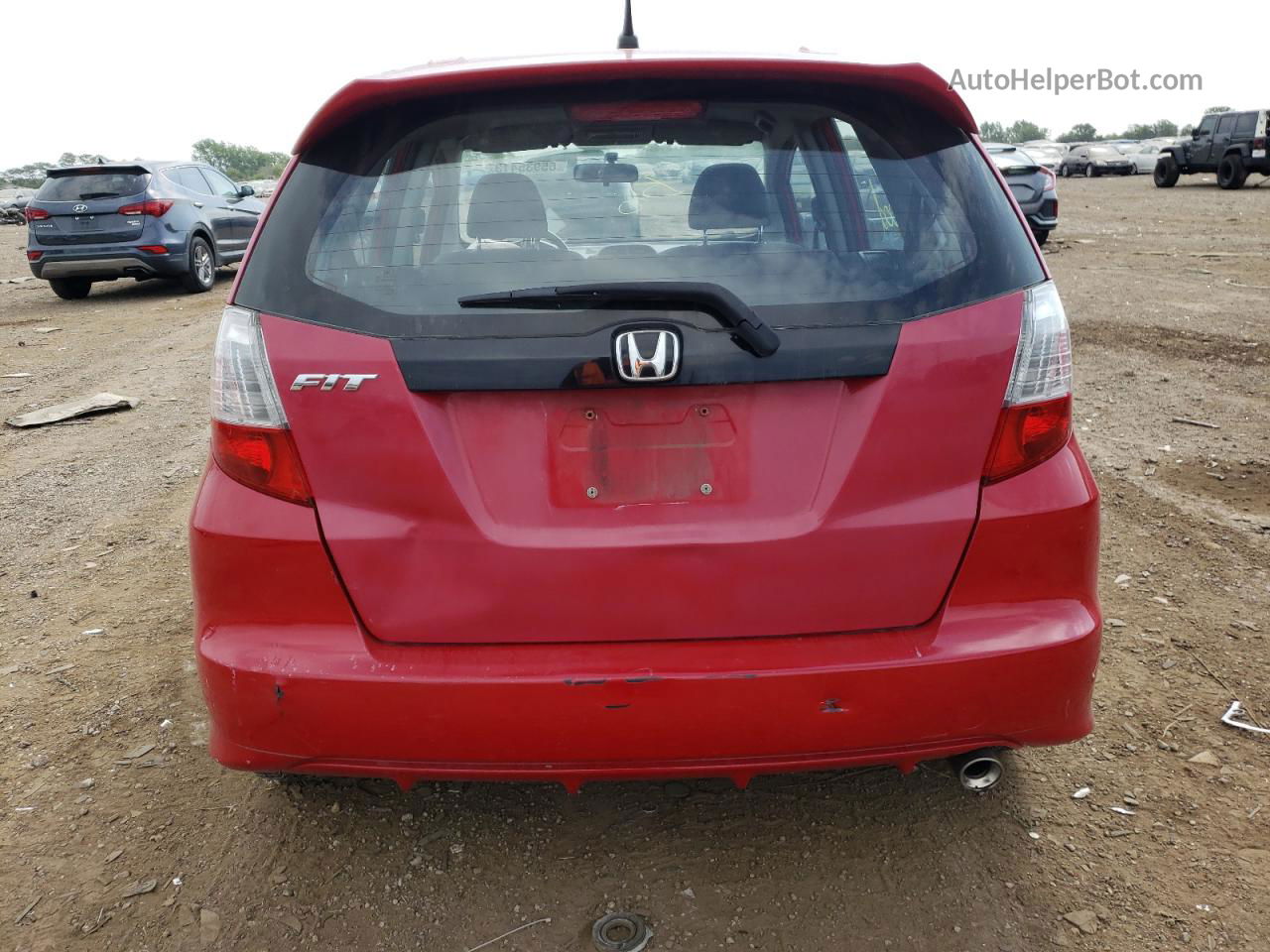 2009 Honda Fit Sport Red vin: JHMGE884X9S033304