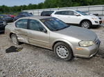 2000 Nissan Maxima Gle Tan vin: JN1CA31D2YT711502