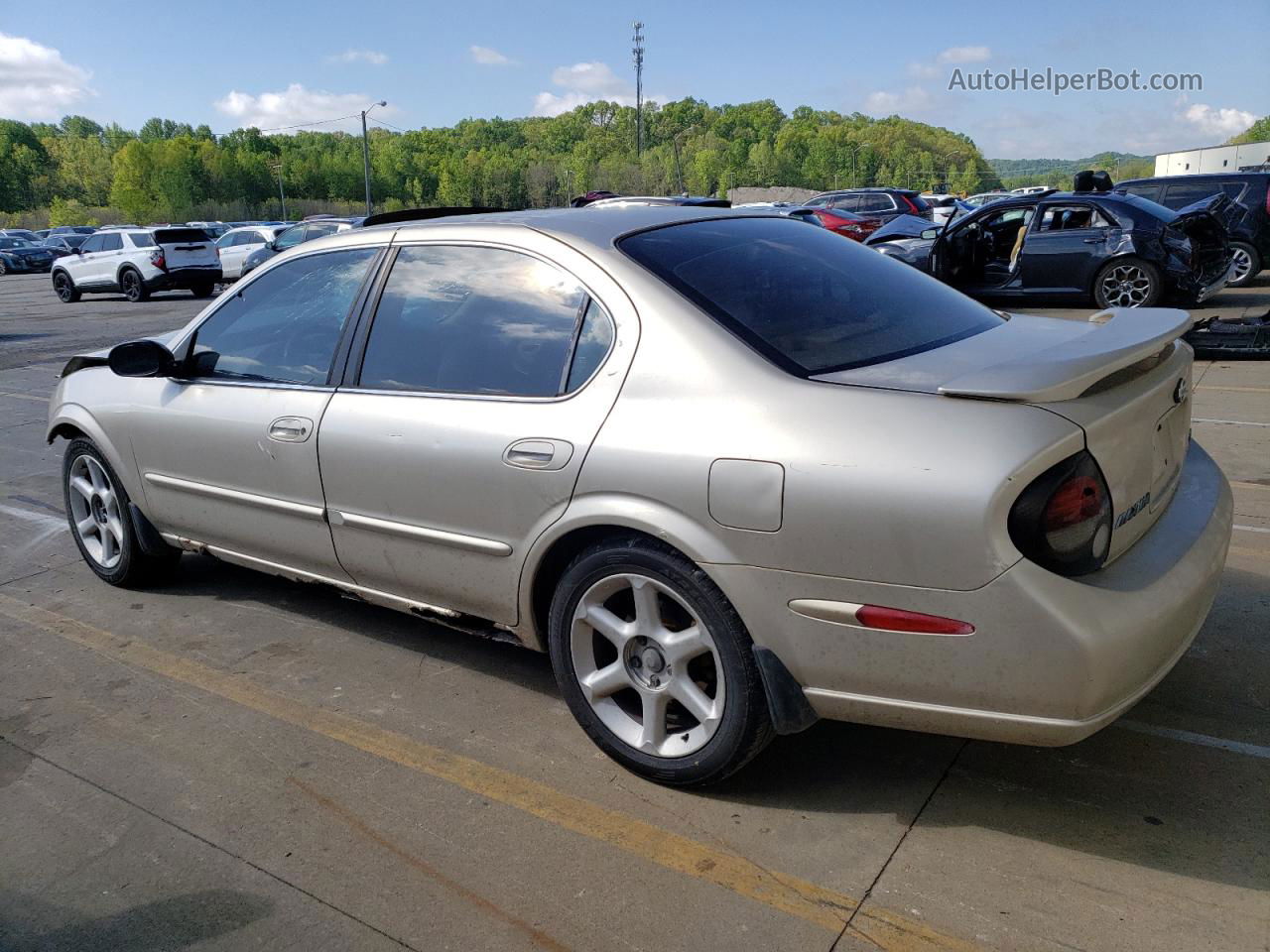 2000 Nissan Maxima Gle Tan vin: JN1CA31D4YT524147