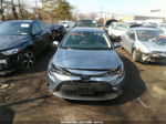 2021 Toyota Corolla Hybrid Le Light Blue vin: JTDEAMDE4MJ034345