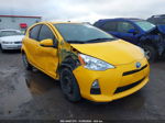 2014 Toyota Prius C Two Yellow vin: JTDKDTB31E1086040