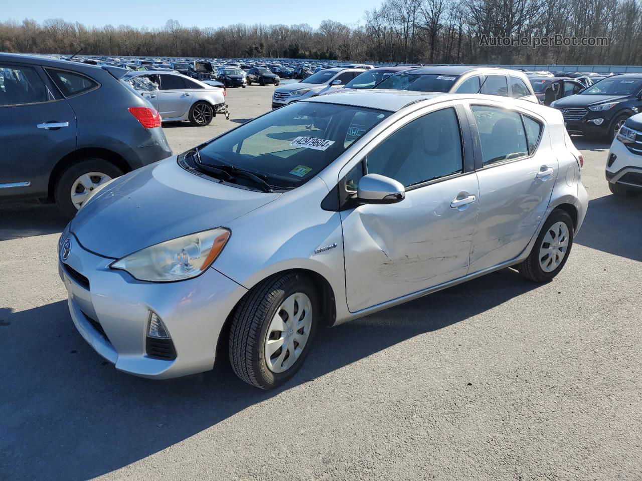 2012 Toyota Prius C  Серебряный vin: JTDKDTB33C1003852