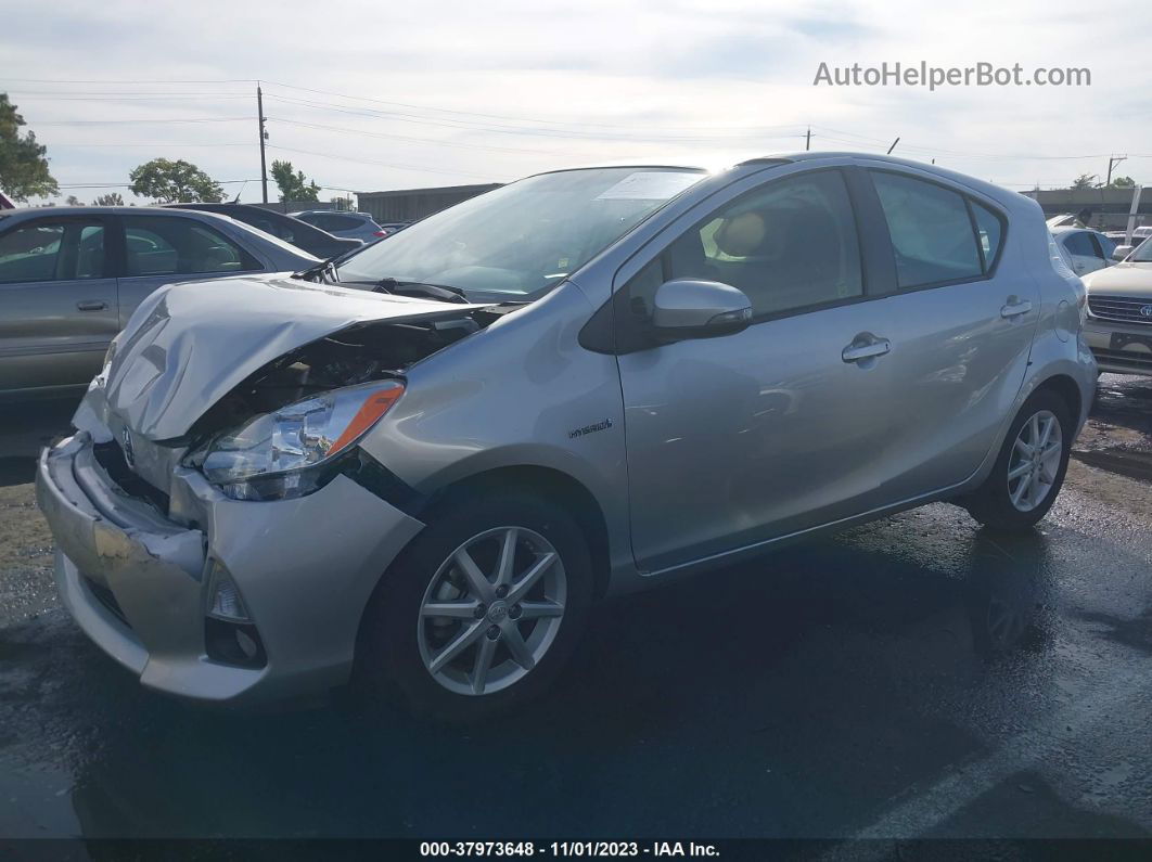 2014 Toyota Prius C Four Серебряный vin: JTDKDTB33E1568279