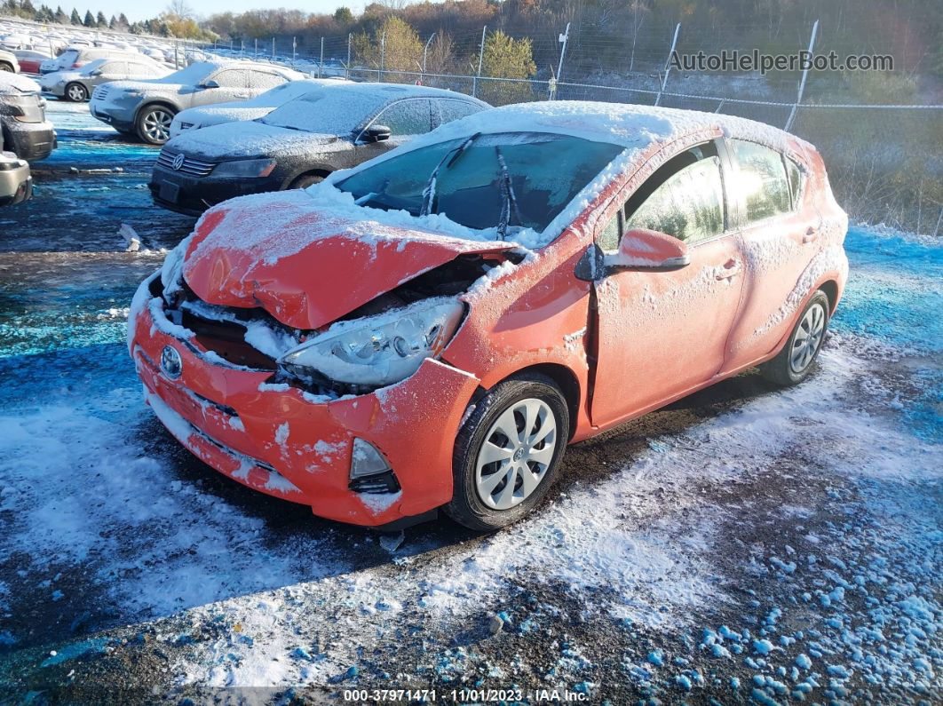 2014 Toyota Prius C Three Оранжевый vin: JTDKDTB36E1072991