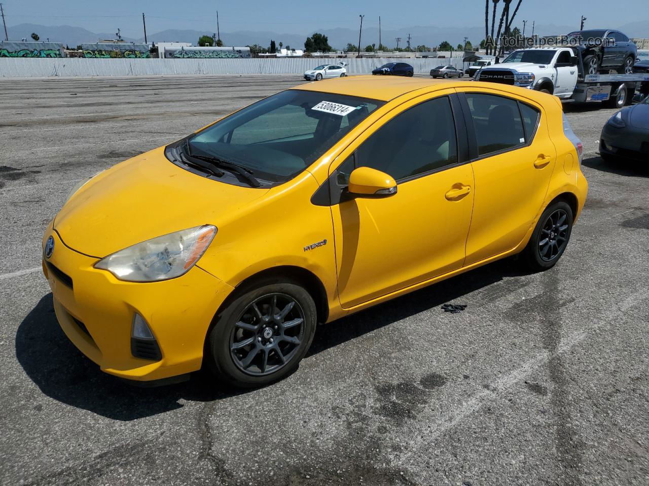 2014 Toyota Prius C  Yellow vin: JTDKDTB38E1060003