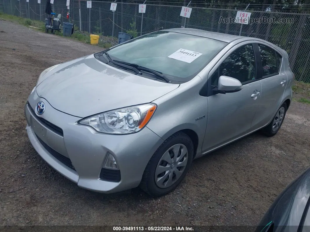 2014 Toyota Prius C Three Серебряный vin: JTDKDTB39E1557710