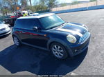 2007 Mini Cooper   Black vin: WMWMF335X7TT51092