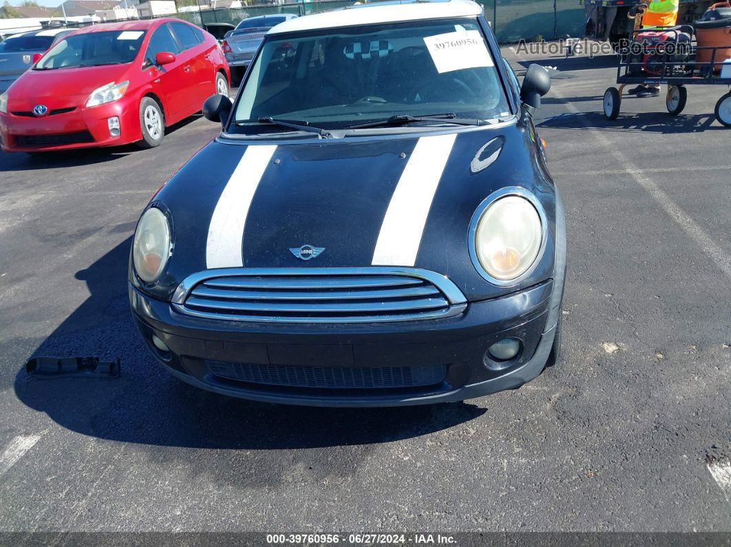 2007 Mini Cooper   Black vin: WMWMF335X7TT51092