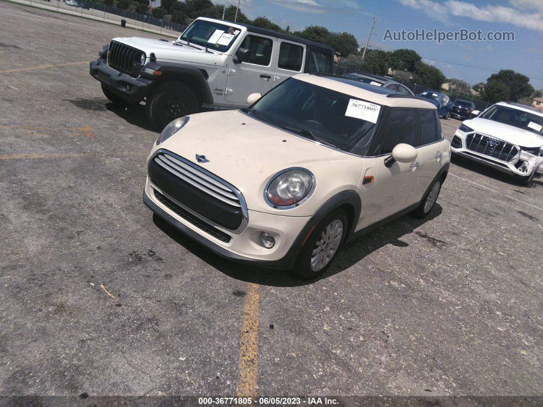 2015 Mini Cooper Hardtop 4 Door   Cream vin: WMWXS5C51FT831556