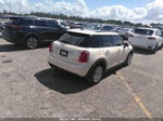 2015 Mini Cooper Hardtop 4 Door   Cream vin: WMWXS5C51FT831556