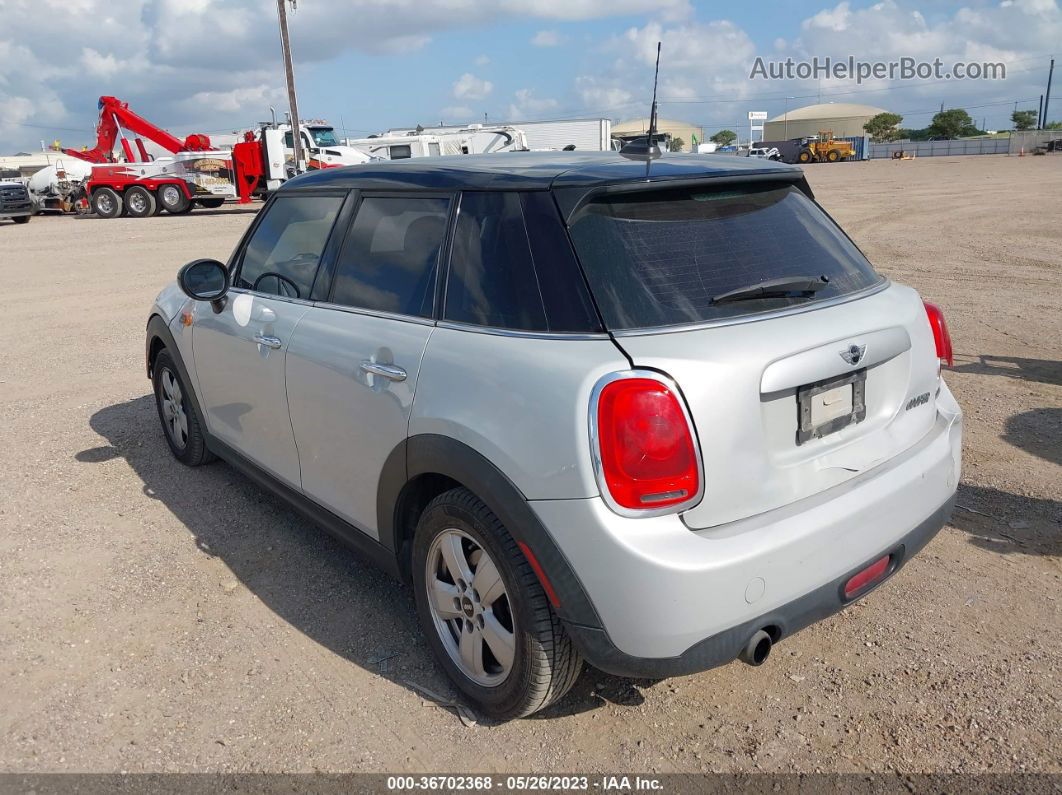 2015 Mini Cooper Hardtop 4 Door   White vin: WMWXS5C51FT837468