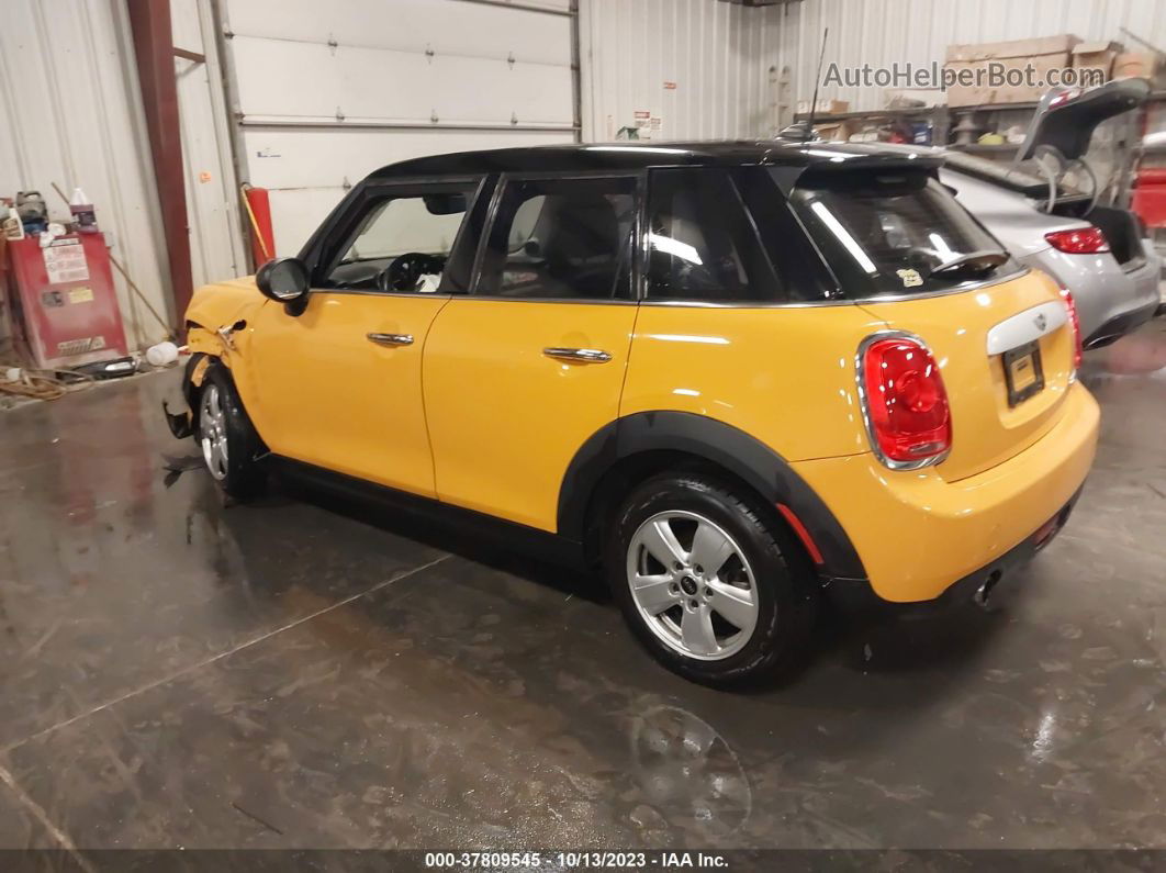 2015 Mini Cooper Hardtop 4 Door   Yellow vin: WMWXS5C55FT832841