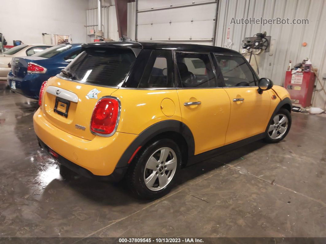 2015 Mini Cooper Hardtop 4 Door   Yellow vin: WMWXS5C55FT832841