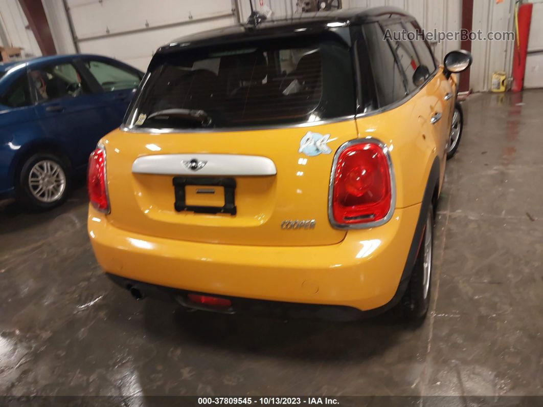 2015 Mini Cooper Hardtop 4 Door   Yellow vin: WMWXS5C55FT832841