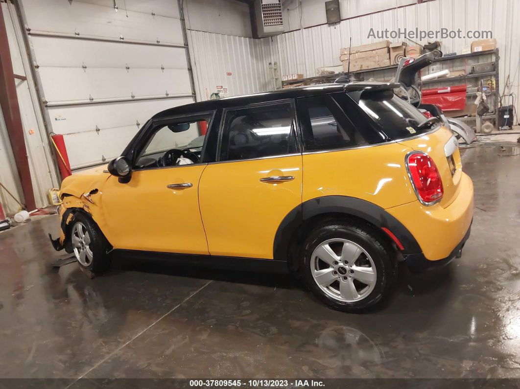 2015 Mini Cooper Hardtop 4 Door   Yellow vin: WMWXS5C55FT832841