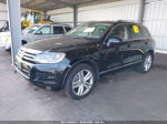 2012 Volkswagen Touareg Exec Черный vin: WVGEF9BP5CD010907